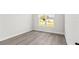 Bright bedroom with new hardwood floors and a window at 6084 Sw 150Th Ln, Ocala, FL 34473