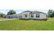 Charming single-story home featuring a well-manicured lawn and inviting curb appeal at 6084 Sw 150Th Ln, Ocala, FL 34473