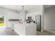 Modern kitchen with stainless appliances, island and backsplash, perfect for cooking and entertaining at 6084 Sw 150Th Ln, Ocala, FL 34473