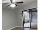 Living room featuring new gray vinyl plank flooring and sliding doors to a screened in lanai at 635 Malaga Ave, Deltona, FL 32725