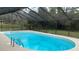 Inviting screened-in pool and enclosure provides privacy and enjoyment in this backyard oasis at 635 Malaga Ave, Deltona, FL 32725