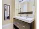 Modern bathroom with glass-enclosed shower, double sinks, and stylish vanity at 7407 Excitement Dr, Reunion, FL 34747