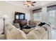 Comfortable living room featuring plush sectional and large television at 7407 Excitement Dr, Reunion, FL 34747