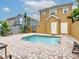 A tranquil pool featuring a brick patio with space for seating and relaxing poolside at 7407 Excitement Dr, Reunion, FL 34747