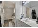 Well-lit bathroom with a large mirror and vanity at 7620 Bay Port Rd # 39, Orlando, FL 32819