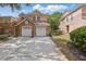 Charming two-story townhome with stone accents, two-car garage, and spacious driveway at 7620 Bay Port Rd # 39, Orlando, FL 32819