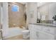 Cozy bathroom with shower and tub combination, decorative plants and picture, and single sink vanity at 9888 Mere Pkwy, Orlando, FL 32832