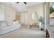 Bright living room with white couch and decorative pillows, and fireplace with television above at 9888 Mere Pkwy, Orlando, FL 32832