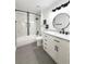 Remodeled bathroom with a new vanity, a tile shower/tub combination, and modern fixtures and finishes at 1010 Loch Vail # 1125, Apopka, FL 32712