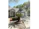 Charming condo exterior with multiple garages, stone accents, and beautiful landscaping with a small palm tree at 1010 Loch Vail # 1125, Apopka, FL 32712