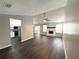 Inviting condo living room with fireplace, and seamless access to kitchen and patio at 1010 Loch Vail # 1125, Apopka, FL 32712