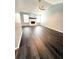 Spacious living room boasts hardwood floors, a white brick fireplace, and lots of natural light at 1010 Loch Vail # 1125, Apopka, FL 32712