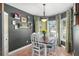 Inviting dining room with a modern table set, decorative lighting, and large bay window at 10783 Satinwood Cir, Orlando, FL 32825