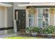 Welcoming front entrance adorned with flowers and a 'Welcome' sign at 10783 Satinwood Cir, Orlando, FL 32825