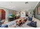 Spacious living room featuring tile floors, comfortable seating, and plenty of natural light at 10783 Satinwood Cir, Orlando, FL 32825