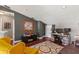 Loft area with a desk and computer, hardwood floors, neutral walls, and natural light at 10783 Satinwood Cir, Orlando, FL 32825