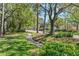 Manicured lawns and mature trees line the street, offering a serene and picturesque neighborhood setting at 10783 Satinwood Cir, Orlando, FL 32825