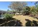 Spacious backyard with mature trees and view of pool screen enclosure at 122 W Hillcrest St, Altamonte Springs, FL 32714