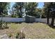 Large backyard featuring a shed, bordered by a white privacy fence and mature trees at 122 W Hillcrest St, Altamonte Springs, FL 32714
