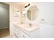 Bathroom featuring dual sinks, two mirrors, and tiled floors at 122 W Hillcrest St, Altamonte Springs, FL 32714