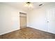 Cozy bedroom with tile flooring, closet space and ceiling fan, providing comfort and functionality at 122 W Hillcrest St, Altamonte Springs, FL 32714