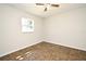 Well-lit bedroom featuring tile flooring, a ceiling fan and a window for natural illumination at 122 W Hillcrest St, Altamonte Springs, FL 32714