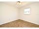 Bright bedroom with tile flooring, neutral walls, ceiling fan, and window offering natural light at 122 W Hillcrest St, Altamonte Springs, FL 32714