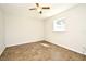 Bedroom featuring a ceiling fan, a window for natural light, and easily maintainable tile flooring at 122 W Hillcrest St, Altamonte Springs, FL 32714