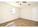 Comfortable bedroom with tile flooring, a window offering natural light, and a ceiling fan at 122 W Hillcrest St, Altamonte Springs, FL 32714
