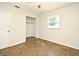 Inviting bedroom with a closet, neutral walls, window for natural light, and practical tile flooring at 122 W Hillcrest St, Altamonte Springs, FL 32714