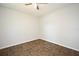 Simple bedroom showcasing tile flooring, neutral walls offering versatility, and a ceiling fan at 122 W Hillcrest St, Altamonte Springs, FL 32714