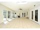 Spacious bonus room with tile flooring, a ceiling fan, and multiple doors that offer backyard access at 122 W Hillcrest St, Altamonte Springs, FL 32714