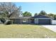 Charming single-story home featuring a well-maintained front yard and attached garage at 122 W Hillcrest St, Altamonte Springs, FL 32714