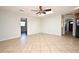 Bright living room features tile flooring, ceiling fan, and skylight at 122 W Hillcrest St, Altamonte Springs, FL 32714