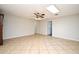 Open living room with tile floor, fan, and bright skylight at 122 W Hillcrest St, Altamonte Springs, FL 32714