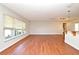 Bright living room features wood floors, large windows, and an open layout perfect for Gathering time at 122 W Hillcrest St, Altamonte Springs, FL 32714