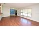 Bright living room featuring hardwood floors, a large window, and an open layout at 122 W Hillcrest St, Altamonte Springs, FL 32714