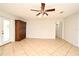 Spacious living room featuring tile flooring and a ceiling fan at 122 W Hillcrest St, Altamonte Springs, FL 32714