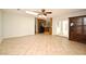 Bright living room with tile flooring, ceiling fan, and decorative cabinet at 122 W Hillcrest St, Altamonte Springs, FL 32714