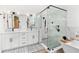 Elegant bathroom with white double vanities, a glass shower, and soaking tub at 12712 Forestedge Cir, Orlando, FL 32828