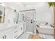 Modern bathroom with a frameless glass shower and free standing tub at 12712 Forestedge Cir, Orlando, FL 32828