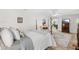 Bedroom featuring hardwood floors, a four-poster bed, and a view into the living room at 12712 Forestedge Cir, Orlando, FL 32828