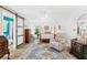 Bedroom features hardwood floors, a four-poster bed, and a leather armchair at 12712 Forestedge Cir, Orlando, FL 32828
