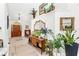 Inviting entryway features high ceilings, wood accents, and decorative plants at 12712 Forestedge Cir, Orlando, FL 32828
