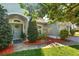 Charming single-story home with a manicured lawn and mature trees at 12712 Forestedge Cir, Orlando, FL 32828