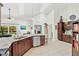 Bright kitchen with granite countertops, stainless appliances, and tile flooring at 12712 Forestedge Cir, Orlando, FL 32828