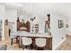 Open kitchen with stainless steel appliances, granite countertops, bar seating, and views to other rooms at 12712 Forestedge Cir, Orlando, FL 32828