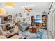 Open concept living area features a view of the kitchen and backyard pool at 12712 Forestedge Cir, Orlando, FL 32828