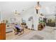 Bright living room features vaulted ceiling, skylight, ceiling fan, and hardwood floors at 12712 Forestedge Cir, Orlando, FL 32828
