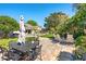 Spacious backyard patio featuring an outdoor dining set and lounge chairs, perfect for entertaining at 12712 Forestedge Cir, Orlando, FL 32828